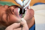 У стоматолога.
Если есть коронки, мосты, пломбы, протезы, то с отбеливанием зубов нужны быть крайне осторожным. Отбеливание никак не отразиться на искусственных частях зубов, т.е. они будут значительно выделяться среди естественных отбеленных зубов. Поэтому в этом случае, отбеливание нужно делать только у стоматолога.
